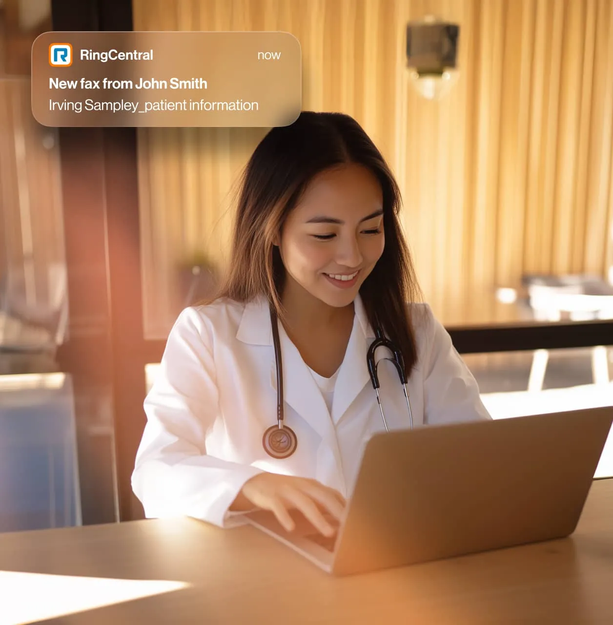 Female doctor reviewing a digital fax on her laptop