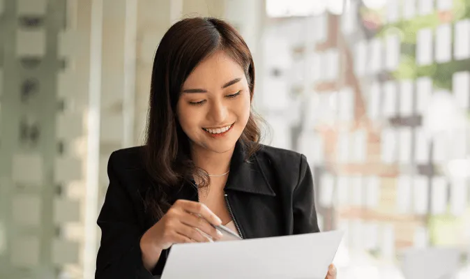 A woman reading the RingSense Service Privacy datasheet