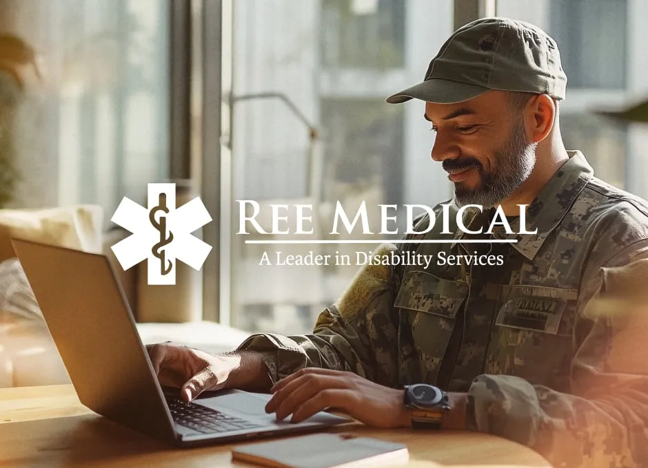 A man wearing fatigues types on a laptop