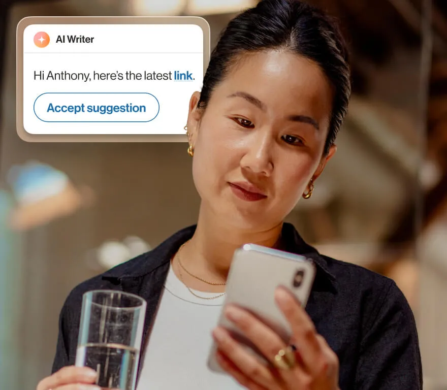 A woman using AI Conversation Expert writer feature to send a message on her phone