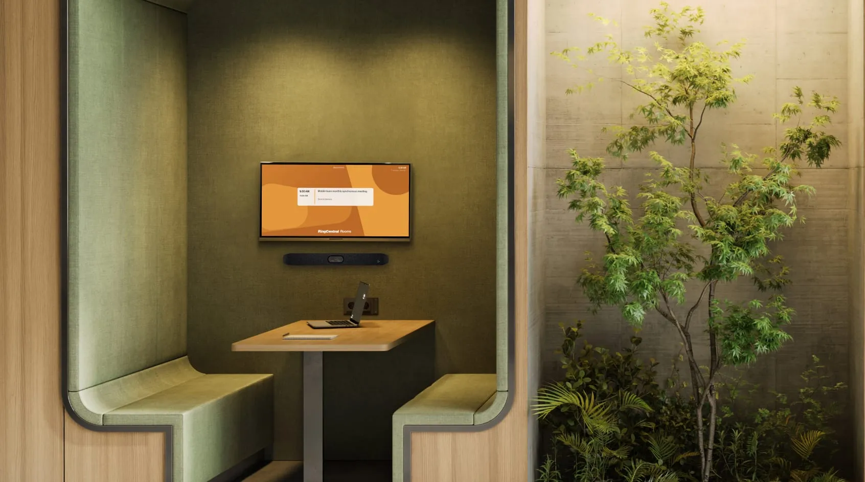 A small meeting room with a laptop on the table